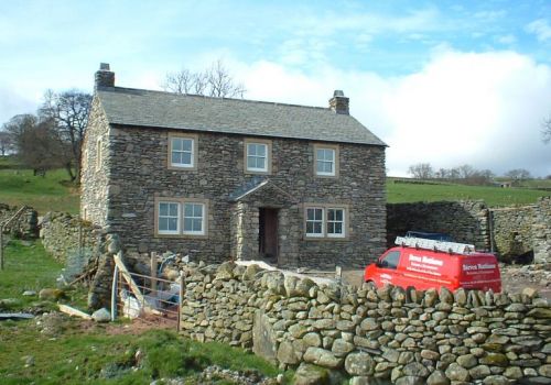 Stone-faced detached house