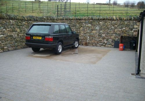 Stone-faced retaining wall